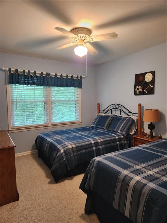 1554 Cooper Lake Road Southeast Smyrna, GA 30082 - Photo 34 of 49 a bedroom with a bed and a window