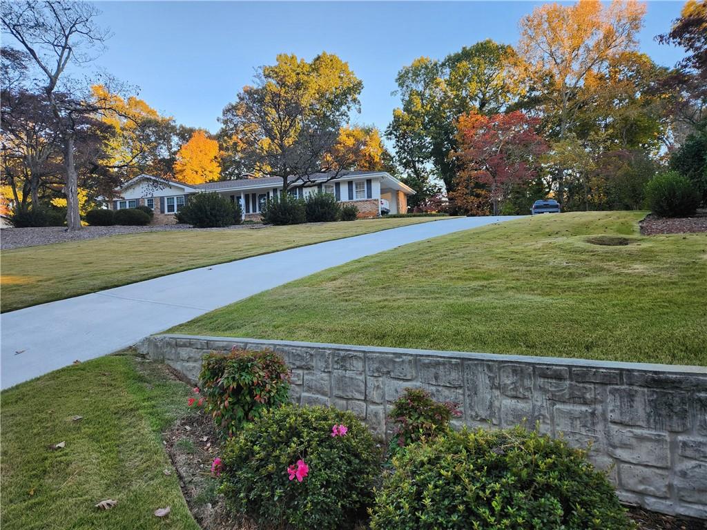 1554 Cooper Lake Road Southeast Smyrna, GA 30082 - Photo 4 of 49 a view of a garden with houses
