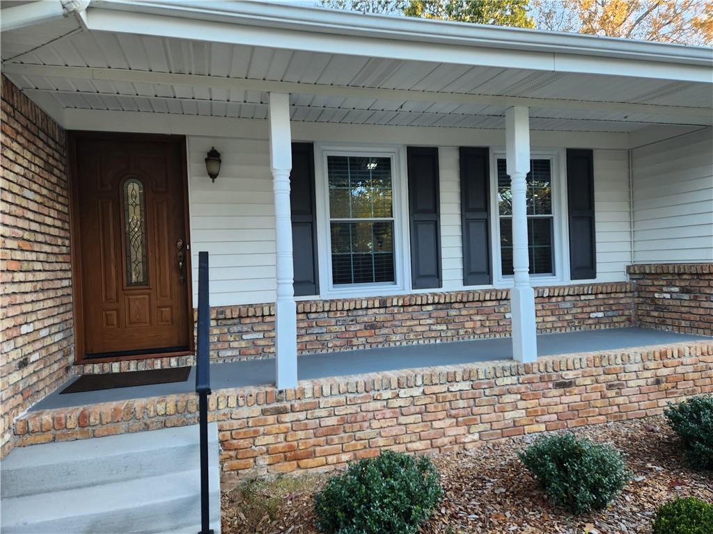 1554 Cooper Lake Road Southeast Smyrna, GA 30082 - Photo 7 of 49 front view of a house