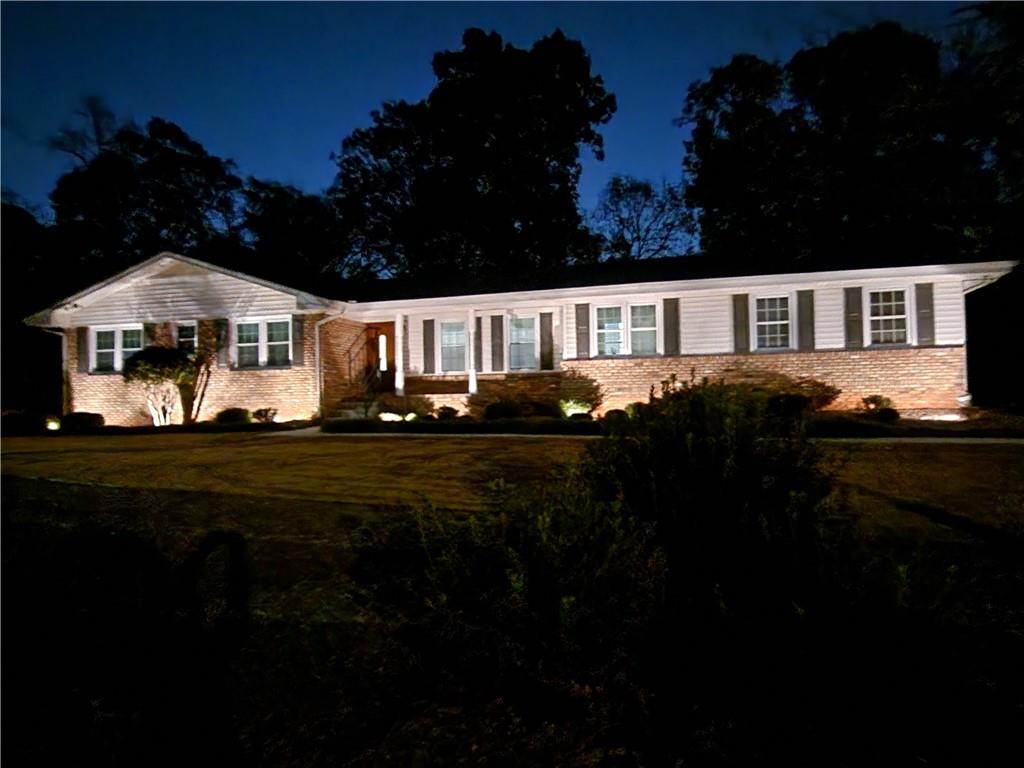 1554 Cooper Lake Road Southeast Smyrna, GA 30082 - Photo 8 of 49 a front view of a house with garden