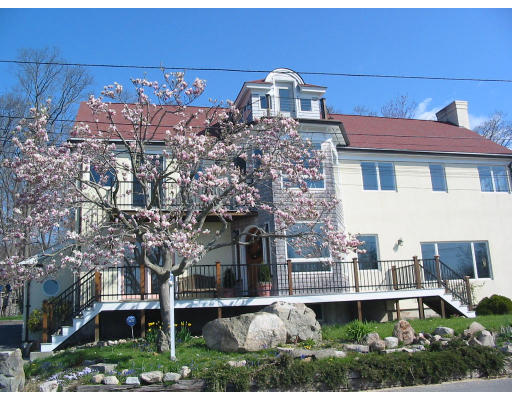 6 Old Salem Path Gloucester, MA 01930 - Photo 1 of 9 a front view of a house with a yard