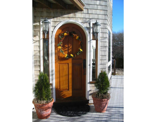 6 Old Salem Path Gloucester, MA 01930 - Photo 2 of 9 a front view of a house with potted plants