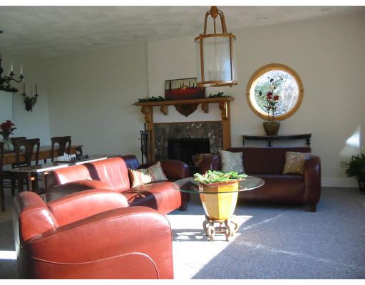 6 Old Salem Path Gloucester, MA 01930 - Photo 8 of 9 a living room with furniture a fireplace and a chandelier