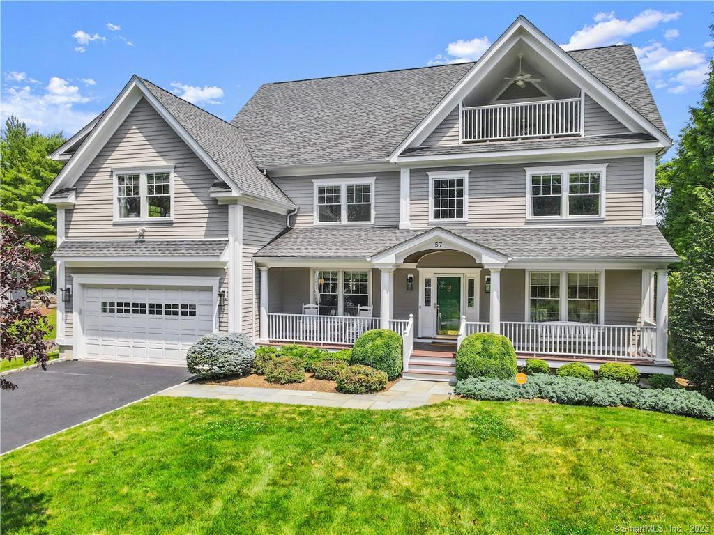 57 Crescent Road Westport, CT 06880 - Photo 1 of 1 a front view of a house with a yard