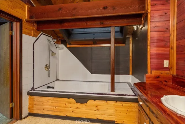 a kitchen with a sink cabinets and a window