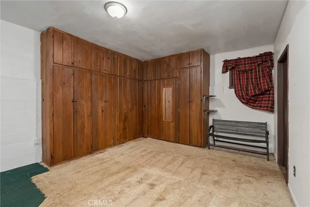 a view of entryway with wooden floor and stairs