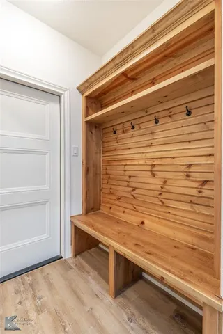 a view of entryway with wooden floor