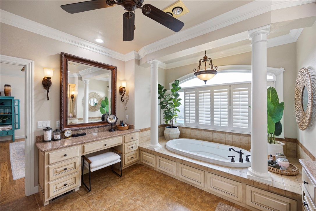 788 Cliff Road Russellville, AR 72802 - Photo 24 of 60 Full bathroom with vanity, a garden tub, ornate columns, ornamental molding, and ceiling fan