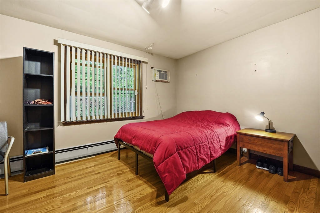 577 Grove Street Worcester, MA 01605 - Photo 17 of 39 a bedroom with a bed and a window