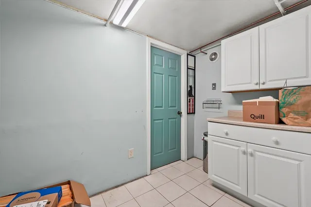 a kitchen with stainless steel appliances kitchen island granite countertop a refrigerator and a stove