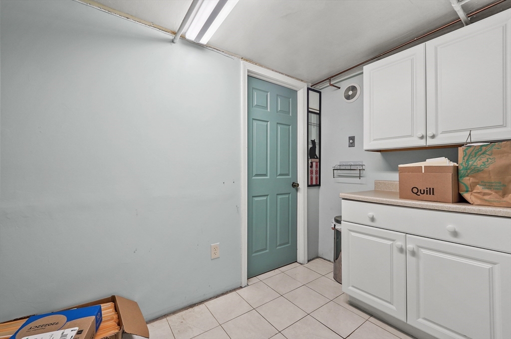 577 Grove Street Worcester, MA 01605 - Photo 21 of 39 a utility room with cabinets