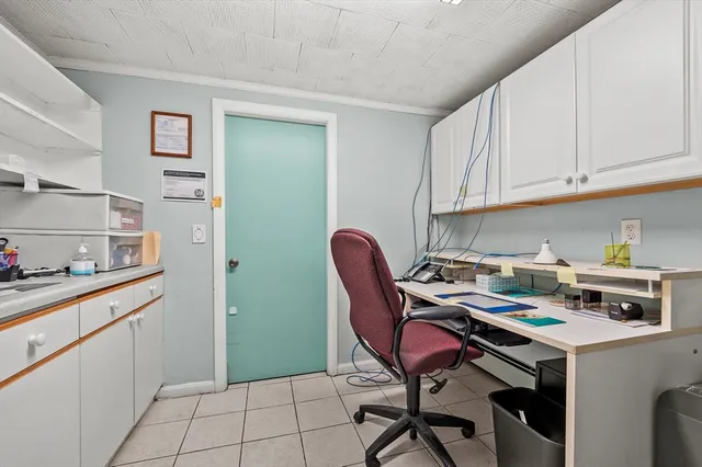 a view of a chair and table in the backyard