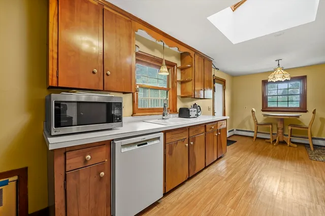 a kitchen with stainless steel appliances granite countertop a stove and a refrigerator