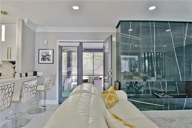 a kitchen with granite countertop a sink stainless steel appliances and cabinets
