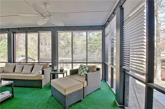 a dining room with furniture and entryway