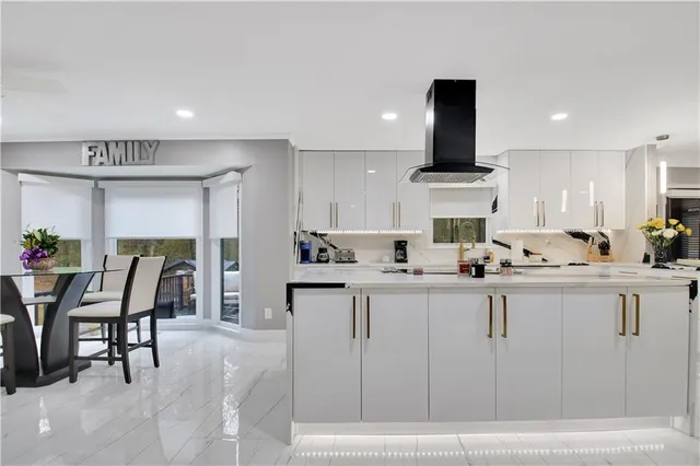 a bathroom with a granite countertop sink a mirror and a vanity