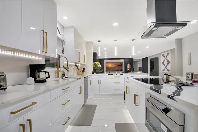 a spacious bedroom with a bed and glass walk in closet