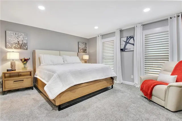 a view of walk in closet with clothes