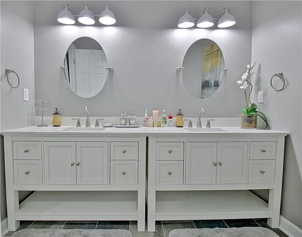 a bedroom with furniture and a large window