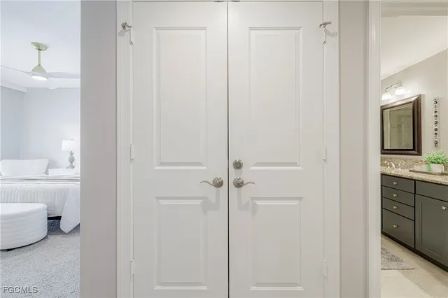 a bathroom with a shower a sink and a mirror