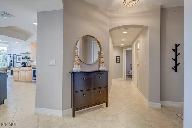 a view of a hallway to a livingroom and a couch