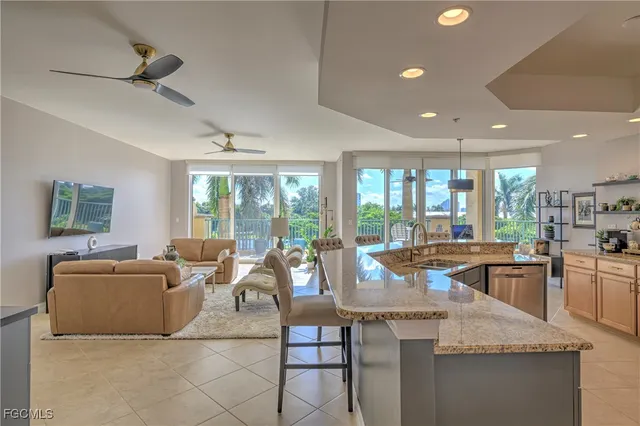 a living room with granite countertop couches and fireplace