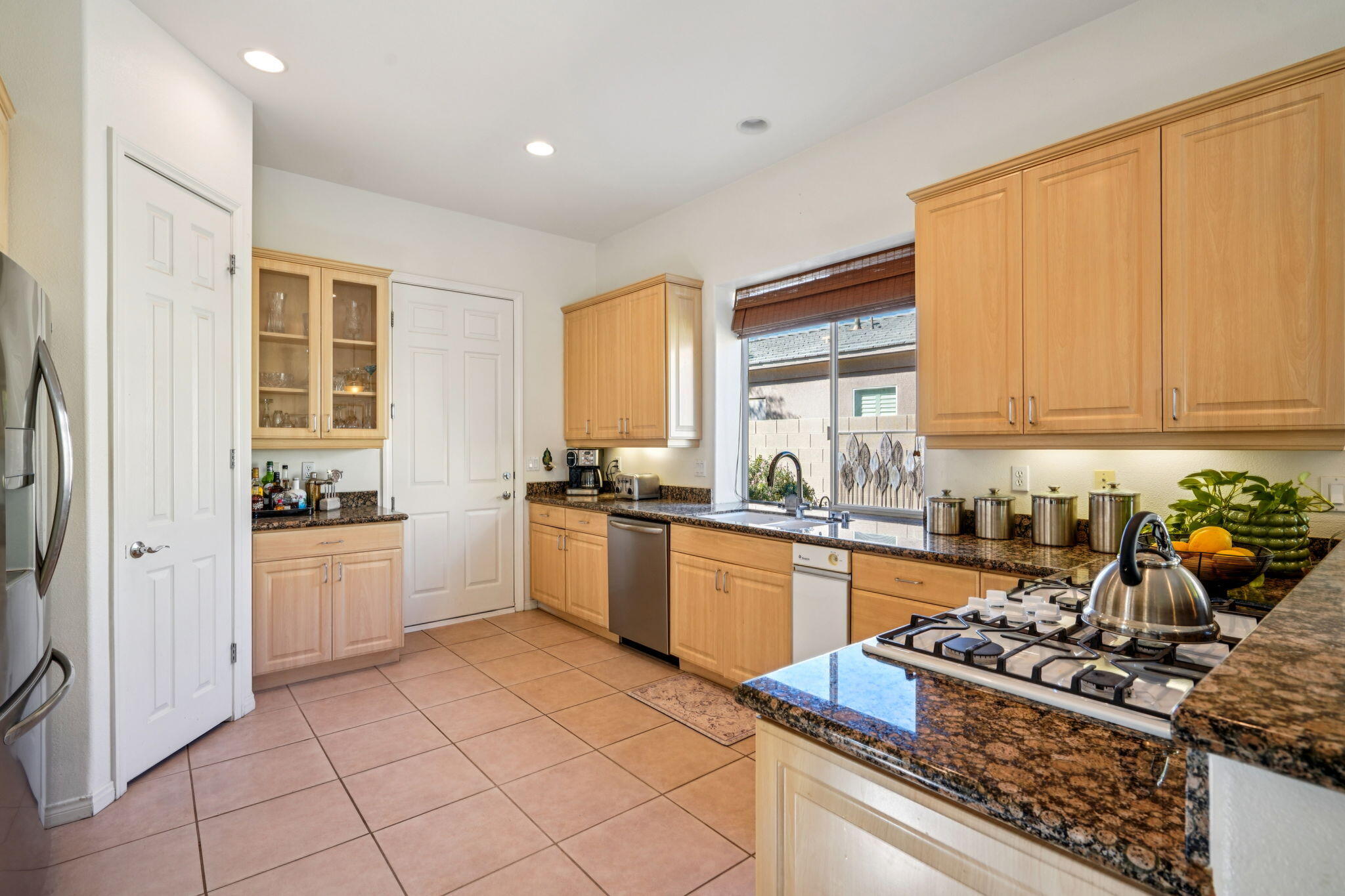 64 Paris Way Rancho Mirage, CA 92270 - Photo 11 of 47 Kitchen with garage access