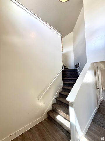 1823 South Longview Road Santaquin, UT 84655 - Photo 5 of 69 Carpeted staircase with white balustrade and handrail