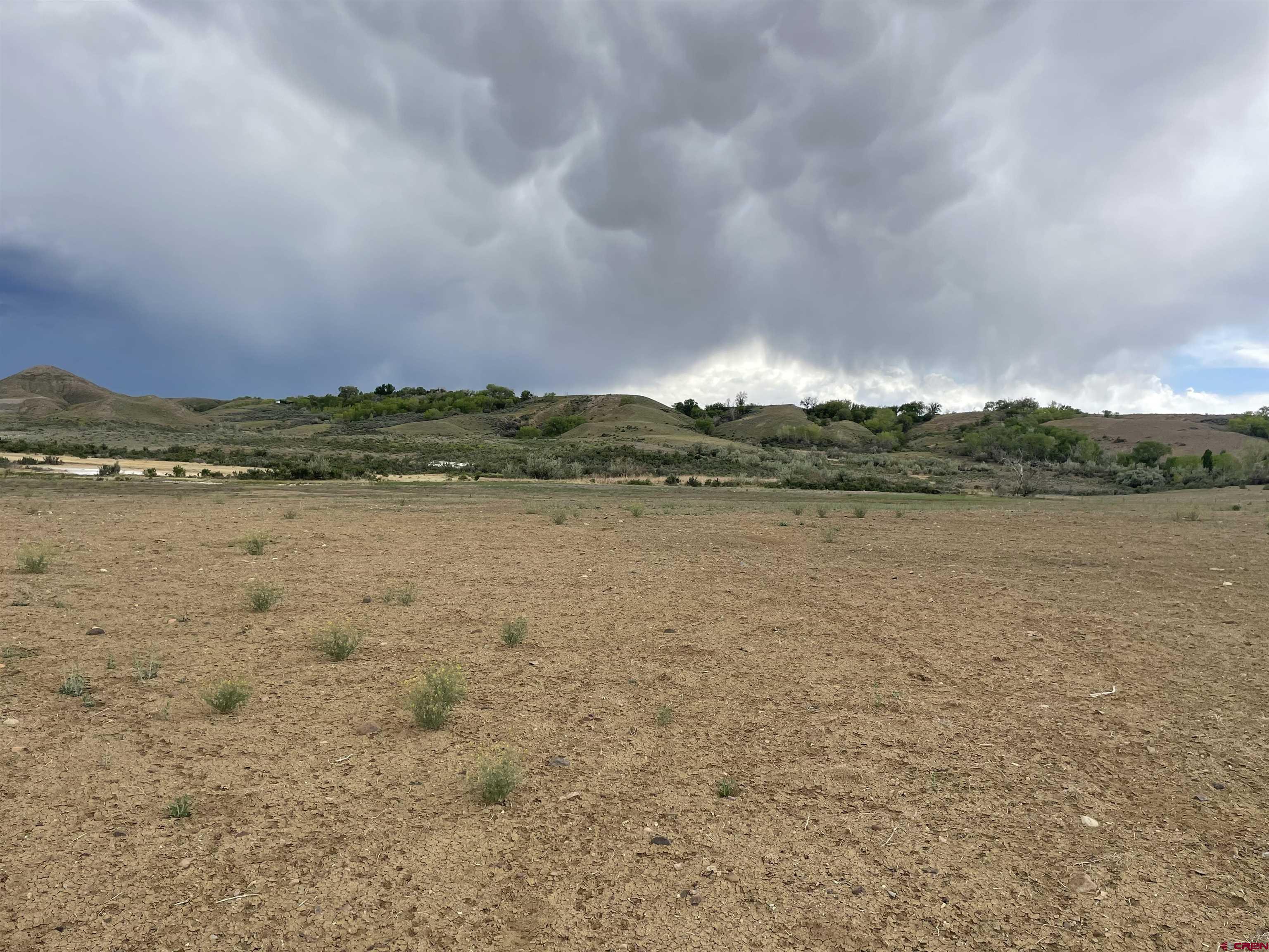 Lot 3 Jig Road Montrose, CO 81403 - Photo 8 of 9 a view of a lake with houses in the back