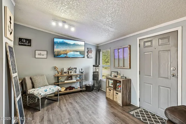 a en suite bathroom with a double vanity sink and a mirror