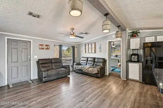 a view of balcony with wooden floor and seating space