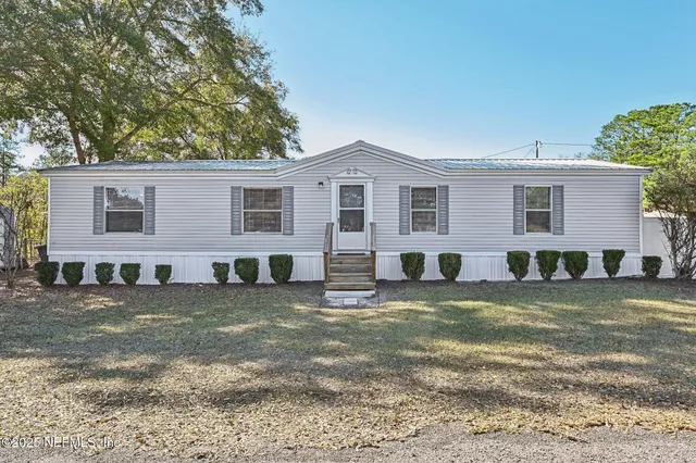 a view of a yard in front of a house