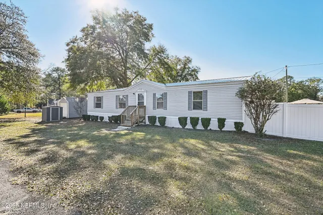 a backyard of a house with lots of green space