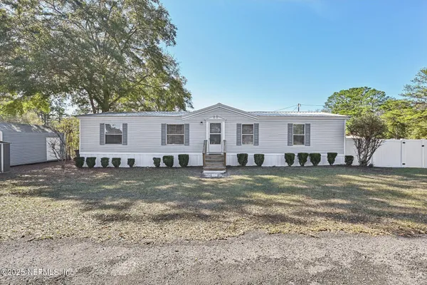 a backyard of a house with lots of green space