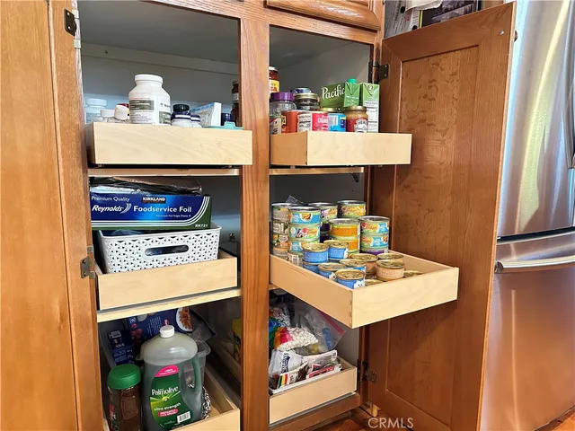 a view of a patio with table and chairs and potted plants