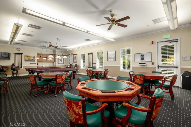 an aerial view of a house with a swimming pool patio and outdoor seating