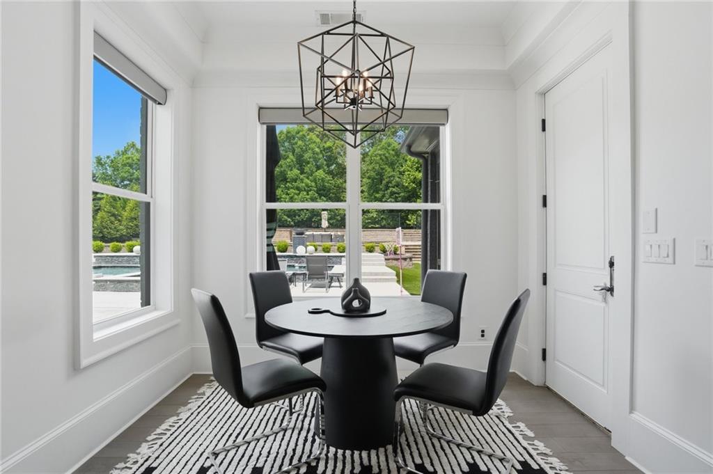 3020 Wallace Road Buford, GA 30519 - Photo 14 of 66 a view of a dining room with furniture window and outside view