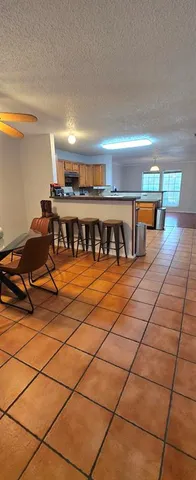 a living room with a washer and dryer