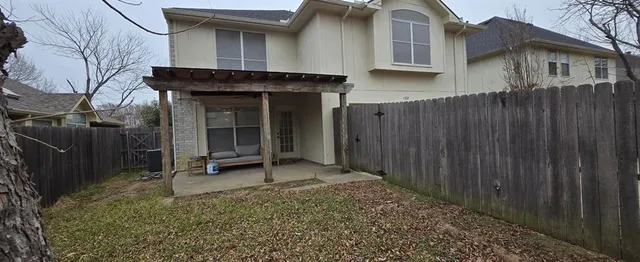 a front view of a house with parking space