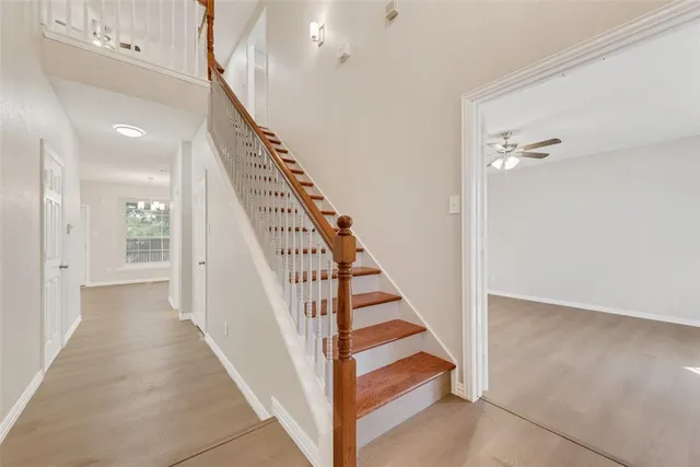 a view of a hallway with staircase