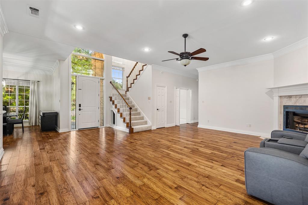 609 Seville Road Denton, TX 76205 - Photo 5 of 40 Open concept living with spacious room and luxurious hand-scraped hardwood floors.