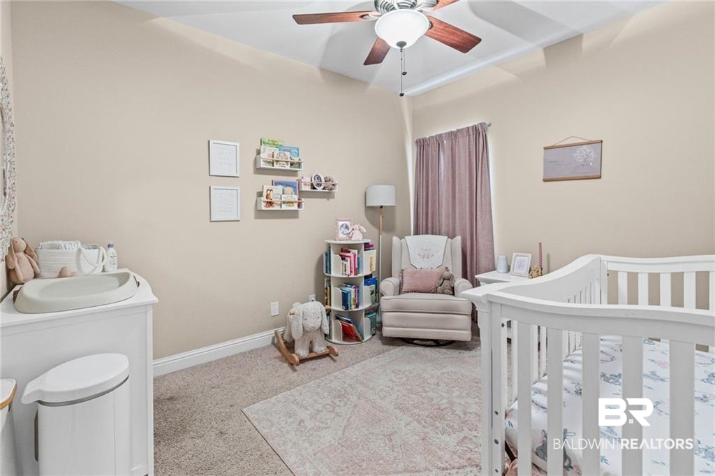 2570 Pecan Pointe Drive Semmes, AL 36575 - Photo 15 of 22 Carpeted bedroom featuring a crib and ceiling fan