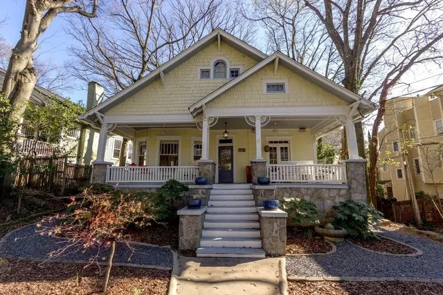a front view of a house with garden