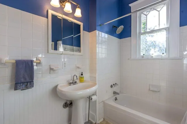 a view of a dining room with furniture wooden floor and chandelier
