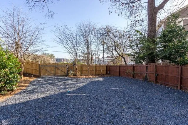 a view of a pathway with a garden