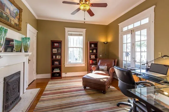 a kitchen with kitchen island granite countertop lots of counter top space a sink appliances and cabinets