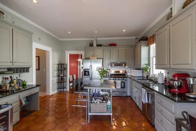 a kitchen with refrigerator and window