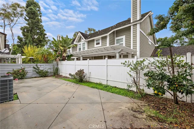 a front view of a house with a yard and a garage