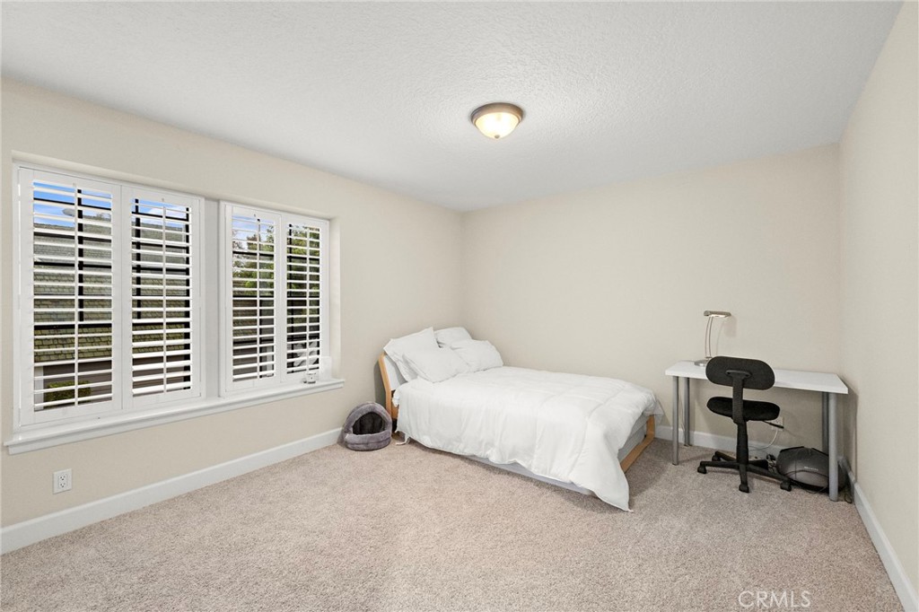 6 Fieldflower Irvine, CA 92614 - Photo 24 of 39 a bedroom with a bed and a window