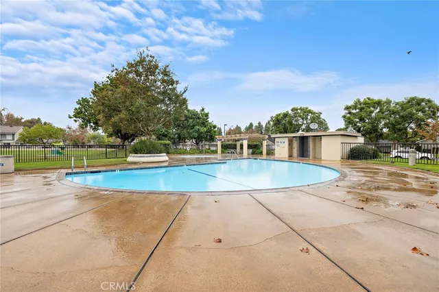 a view of a swimming pool with a yard